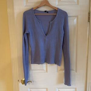 Out from under purple Henley shirt